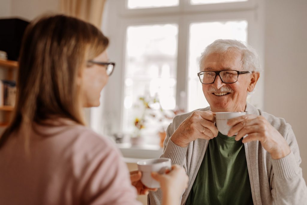 Photo of a senior with a cup in his hands.