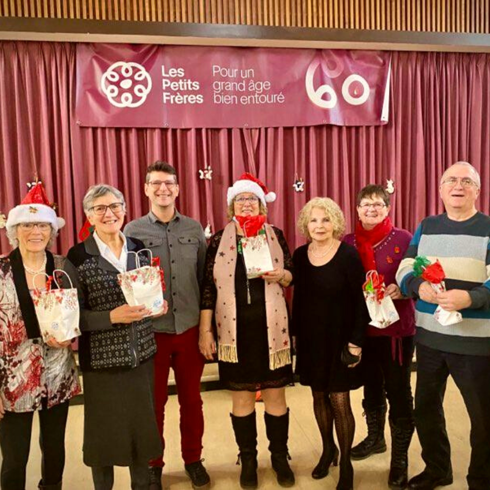 Photo of several seniors and employees posing with their gift bags.